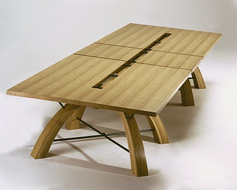 Solid oak conference table to stand in converted 18th century barn. Black metal detail